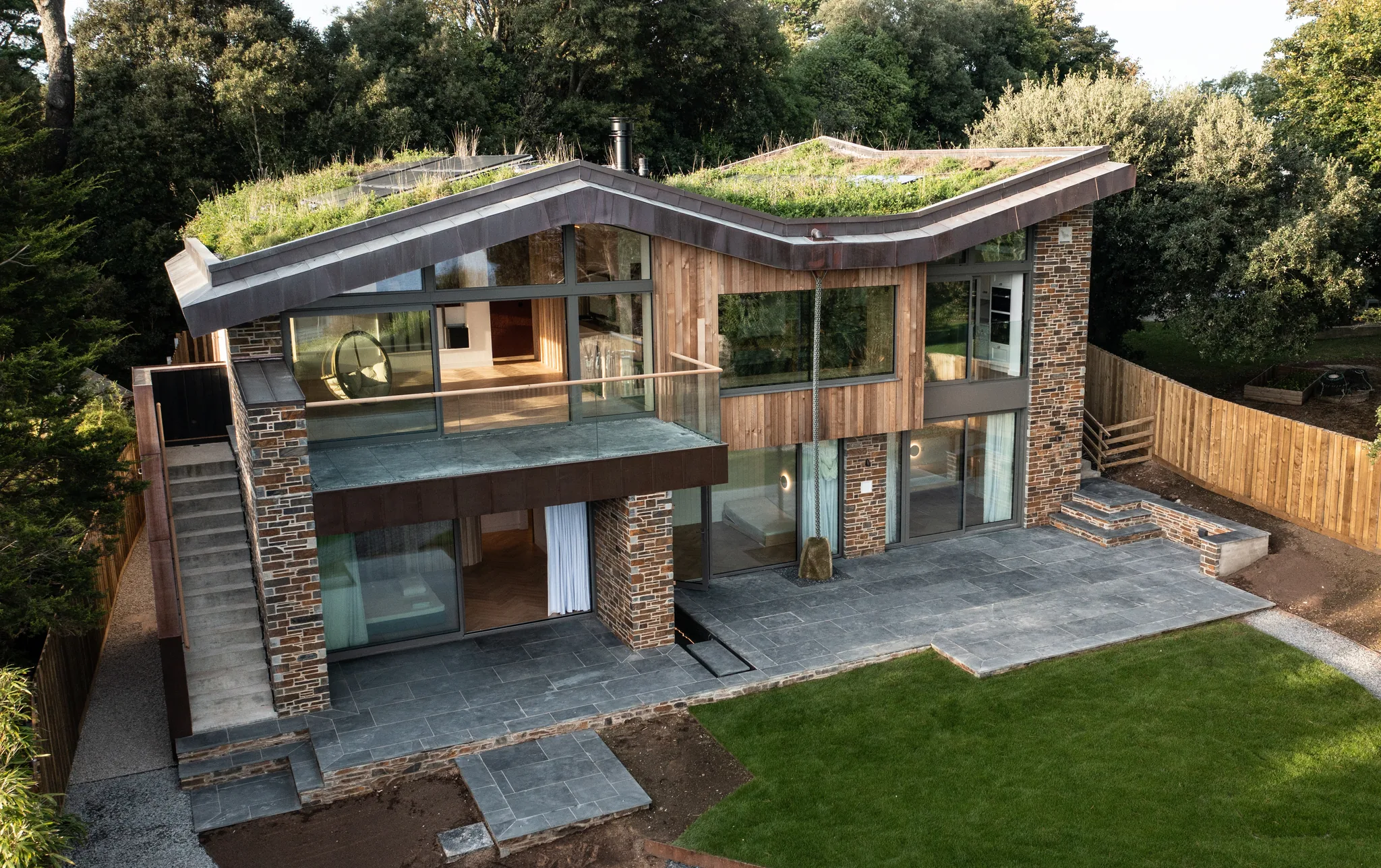 Modern house with green roof aerial view in Cornwall